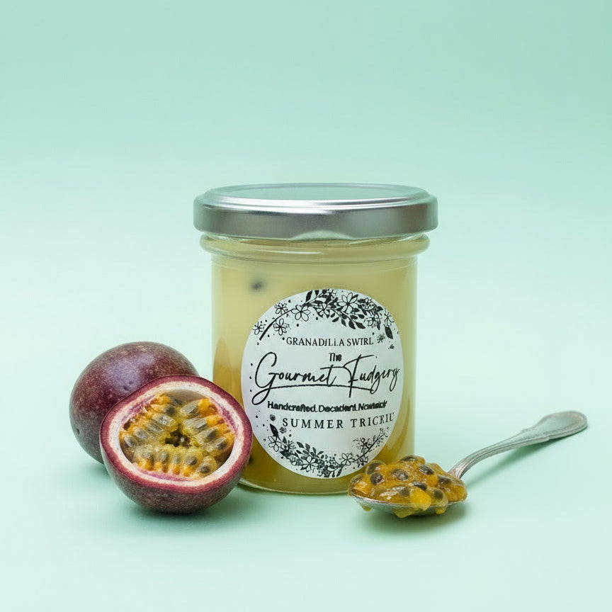 Jar of Granadilla Swirl Gourmet Fudge on a mint background with granadilla and granadilla pulp on a spoon. 